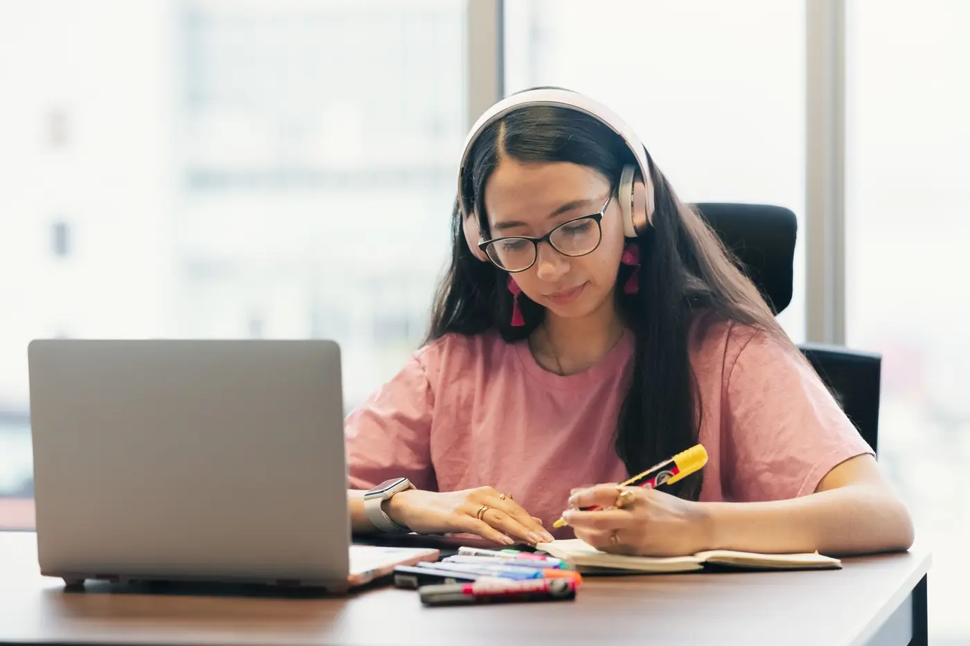 A student with headphones practising English